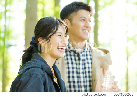 Photo of men and women with plastic bottles Photo of men and women with plastic bottles 103896263