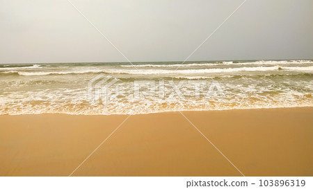 soft wave on a sandy beach 103896319
