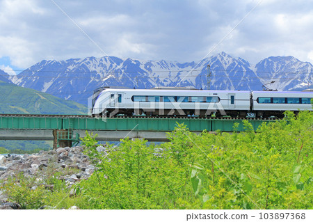 Oito Line Limited Express Azusa going to the foot of Mt. Hakuba in early summer Oito Line Limited Express Azusa going to the foot of Mt. Hakuba in early summer 103897368