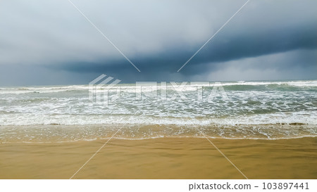 Beautiful waves on the sand beach Beautiful waves on the sand beach 103897441
