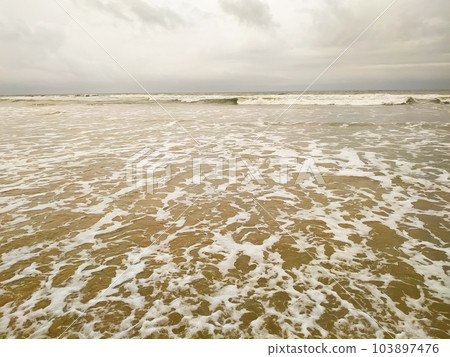 Amazing wave of the sea on the sand beach Amazing wave of the sea on the sand beach 103897476