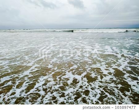 Amazing view of wave of the sea on the sand beach 103897477