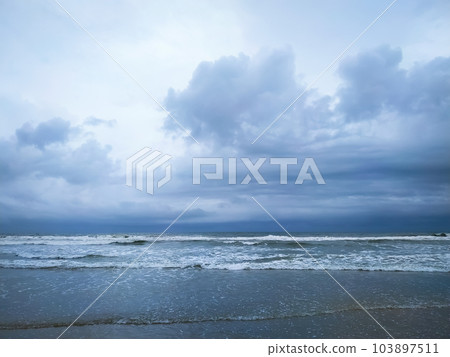 Beautiful cloudy sky over the wave in sea Beautiful cloudy sky over the wave in sea 103897511