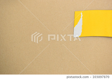 yellow curve paper put on brown background yellow curve paper put on brown background 103897870