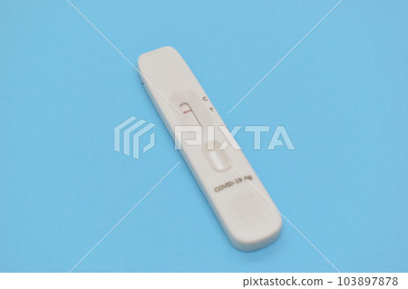 covid test kid on blue background covid test kid on blue background 103897878