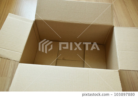 brown post box packaging put on wood floor brown post box packaging put on wood floor 103897880