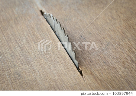 sharp metal saw on wood plank texture background, construction machine sharp metal saw on wood plank texture background, construction machine 103897944