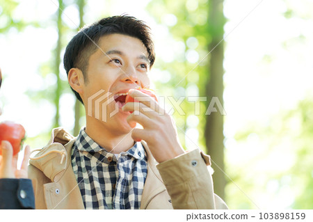 photo of people eating tomatoes 103898159