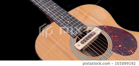 cloise up shot of acoustic guitar sound hole pickup type . made by wood, selective focus cloise up shot of acoustic guitar sound hole pickup type . made by wood, selective focus 103899192