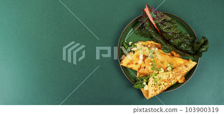 Omelet with greens, space for text 103900319