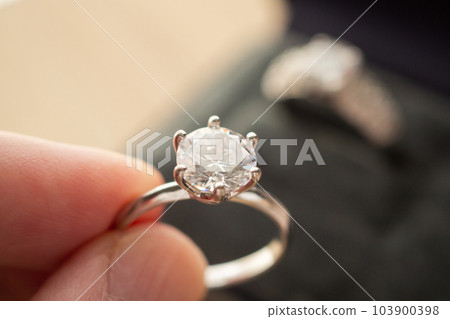 hand hold beautiful jewelry diamond ring hand hold beautiful jewelry diamond ring 103900398