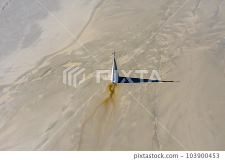 Aerial apocalyptic scene, church tower with cross buried under mud and toxic copper mining residuals 103900453