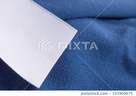 laundry care clothing label on blue dress 103900675