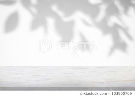 Marble table with tree shadow drop on white wall background for mockup product display 103900709