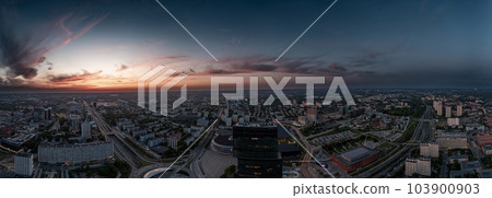 Panoramic drone image of the center of the Polish city of Katowice in the evening.  103900903