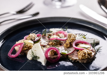 Duck pate served with red onion, cauliflower, raddish and mustard seeds 103901206