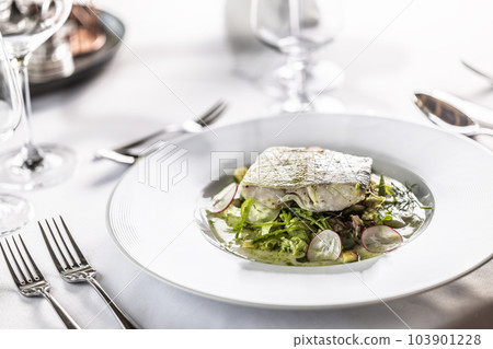 Cog fish served with green salad and wine dressing 103901228