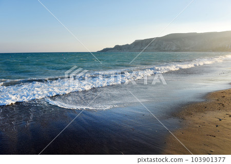 Sea waves and beach at sunset 103901377
