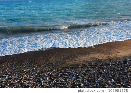 Sea waves and beach at sunset 103901378