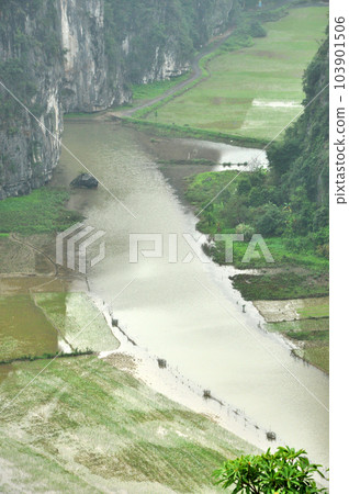 Panorama view of rice fields and limestone rocks and from Hang Mua Temple viewpoint 103901506