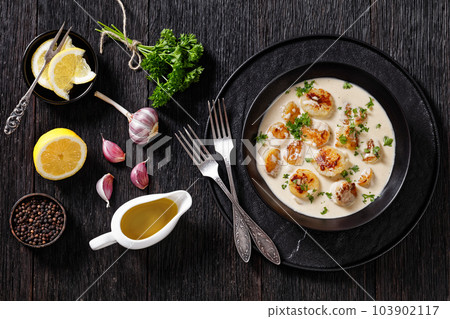scallops with white wine cream sauce, top view scallops with white wine cream sauce, top view 103902117