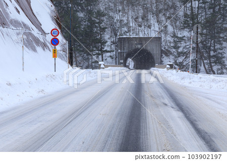 Image of road frozen in midwinter 103902197