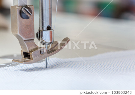 Sewing machine needle with thread and fabric 103903243
