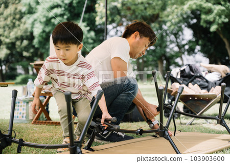 Family image of preparing and cleaning up at camp 103903600