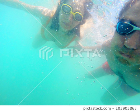 Couple having fun underwater in the sea 103903865