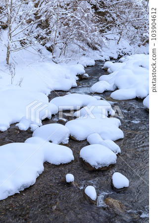 Image of river covered with snow in the middle of winter Image of river covered with snow in the middle of winter 103904612