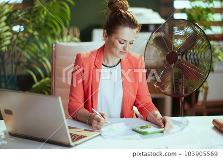 modern accountant woman in modern green office in red jacket 103905569