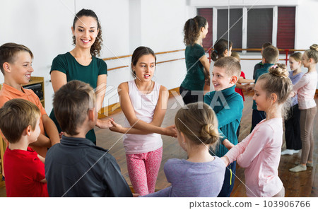 Boys and girls studying folk dance in studio Boys and girls studying folk dance in studio 103906766