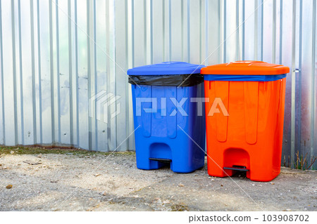 Color garbage bins in the city street on metal background Color garbage bins in the city street on metal background 103908702