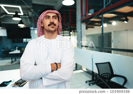 Successful muslim businessmen in traditional outfit in his office 103909386