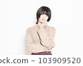 A young woman thinking in front of a white background 103909520