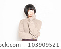 A young woman thinking in front of a white background 103909521