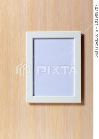 Blank photo frame on the table Blank photo frame on the table 103909707