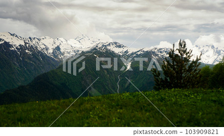 A panoramic view on the snow-capped peaks. Greater Caucasus Mountain Range 103909821