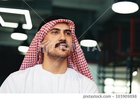 Successful muslim businessmen in traditional outfit in his office 103909898