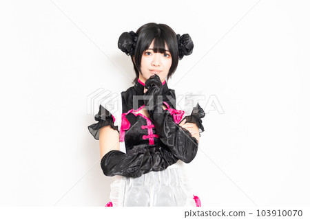 A maid thinking in front of a white background A maid thinking in front of a white background 103910070