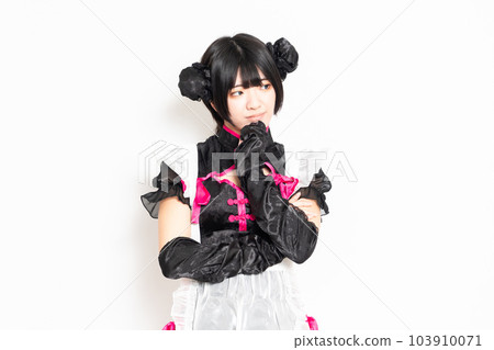 A maid thinking in front of a white background 103910071