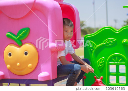 Cute asian child having fun at playground. 103910563
