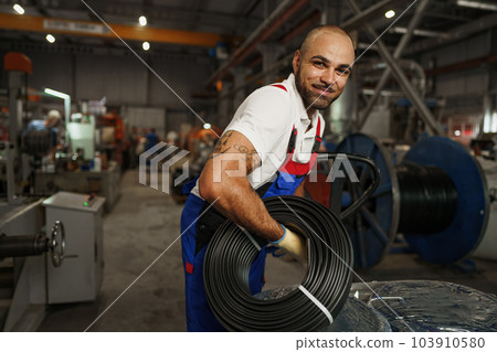Portrait of a smiling handsome african american factory worker Portrait of a smiling handsome african american factory worker 103910580