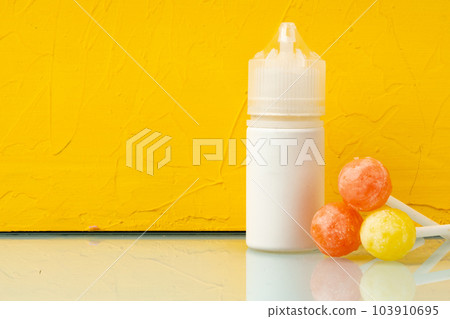 Bottle with aromatic vaping liquid for e-cigarette, candy flavour 103910695