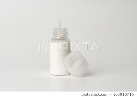 Refill liquid for electronic cigarettes on gray background Refill liquid for electronic cigarettes on gray background 103910710