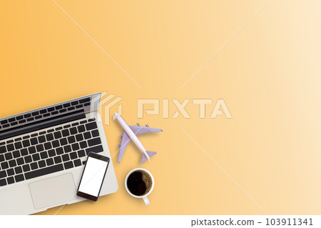 Office desk or workspace with laptop computer, coffee cup and smartphone with copy space  103911341
