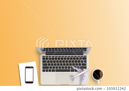 Office desk or workspace with laptop computer, coffee cup and smartphone with copy space  103911342