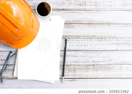 Office desk glasses,pencil,coffee cup and white paper on a white wood table background. Office desk glasses,pencil,coffee cup and white paper on a white wood table background. 103911362