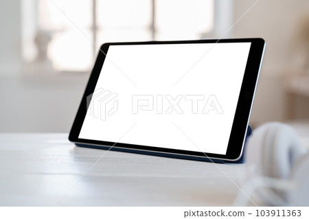 White working table with blank screen digital tablet White working table with blank screen digital tablet 103911363