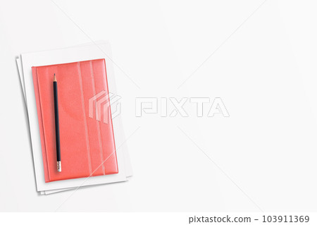 Office desk or modern workspace with pencil and pink notebook copy space on white background 103911369